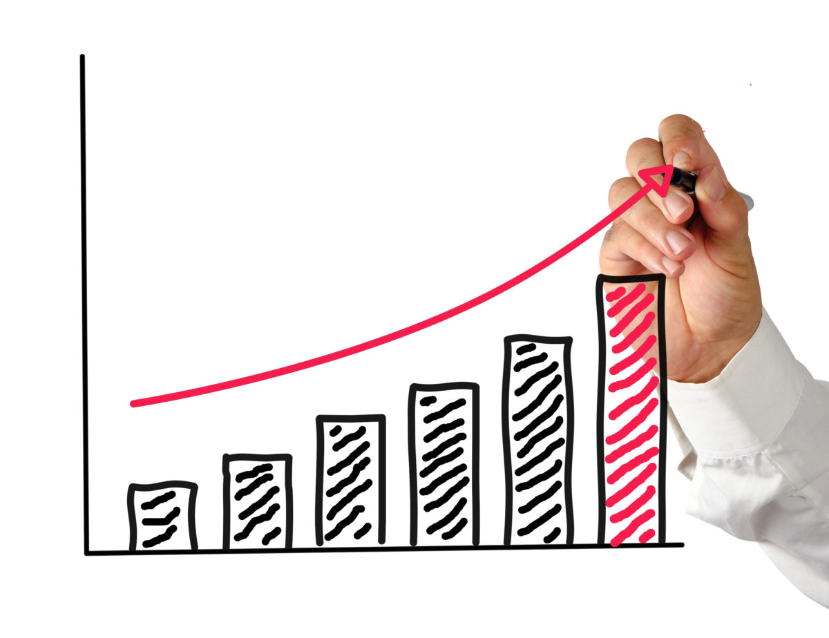 Hand drawing rising bar chart with arrow