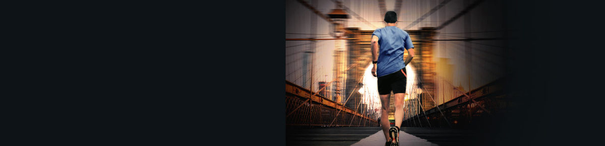 Runner on urban suspension bridge at dusk